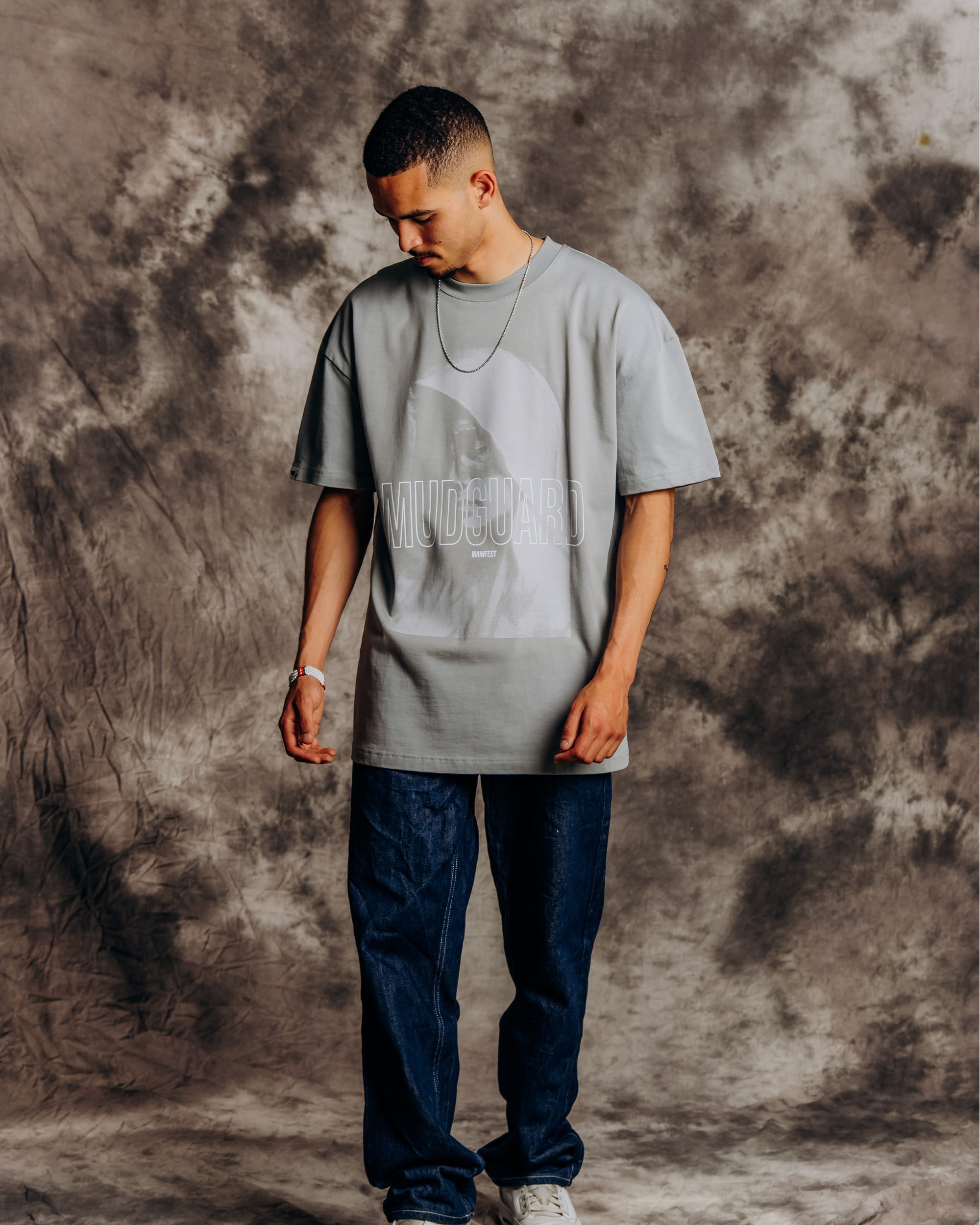 Mudguard Absence Tee model front view with halftone graphic