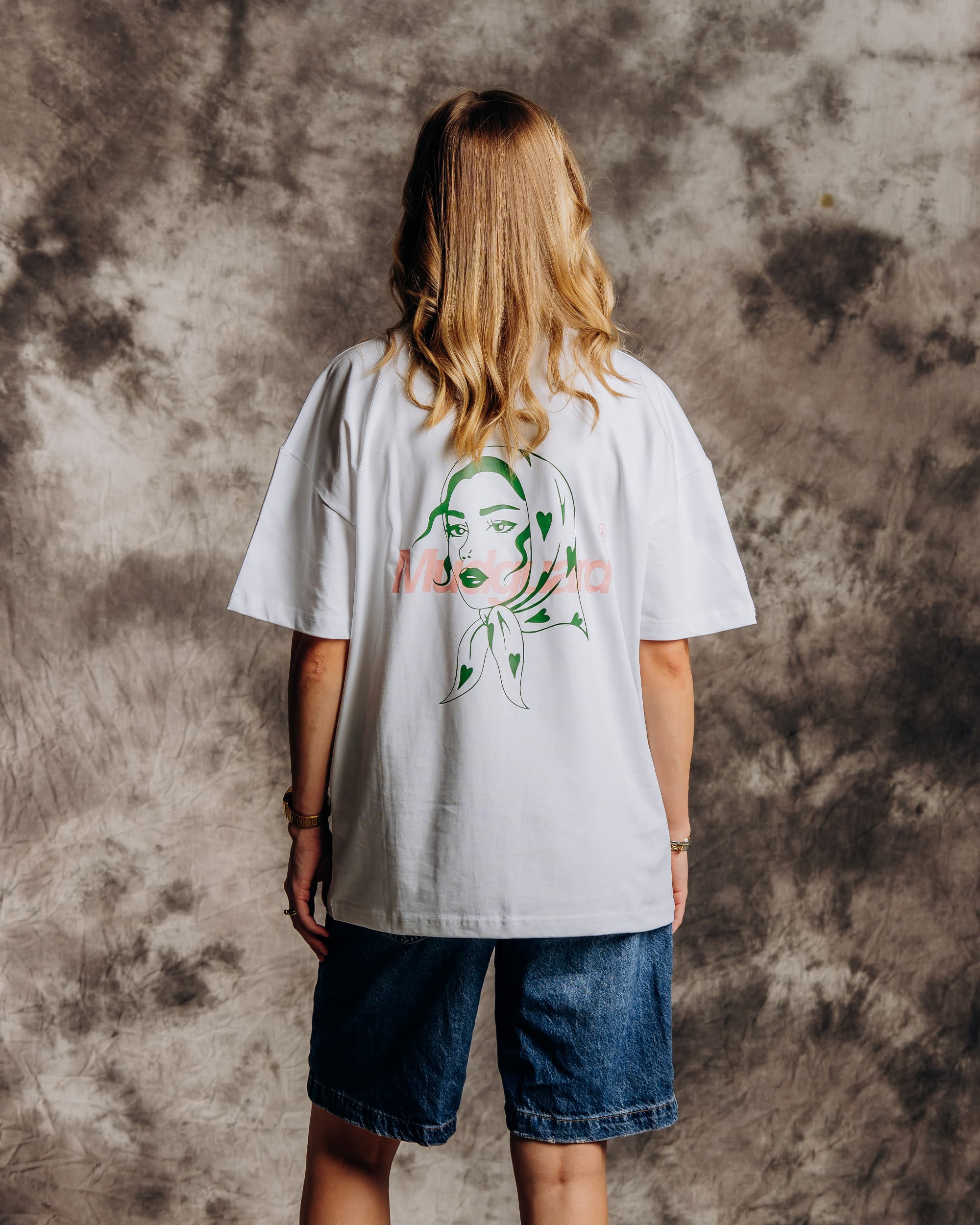 Oversized white streetwear tee side profile on model