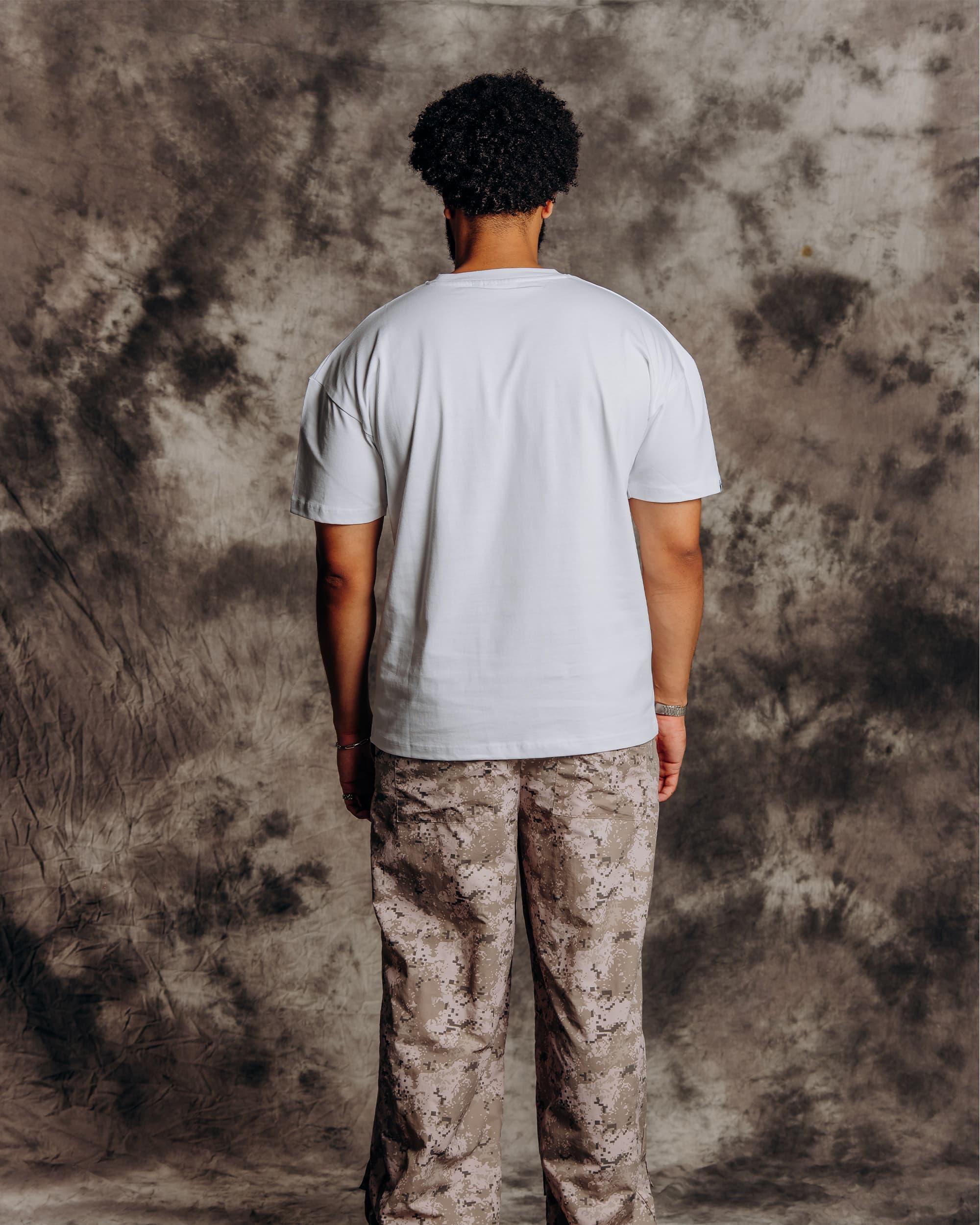 Oversized white graphic t-shirt model back view