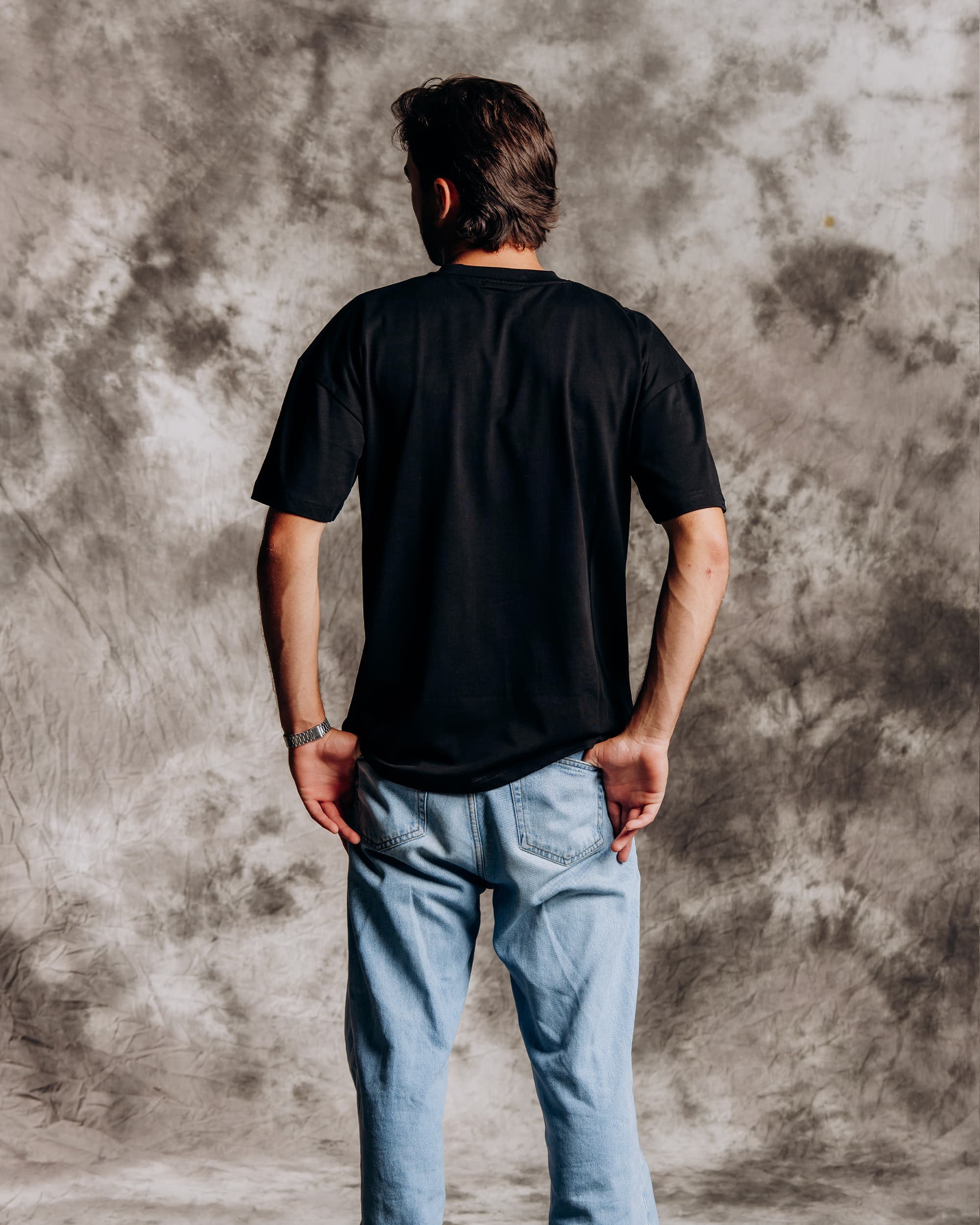 Oversized black graphic t-shirt model back view