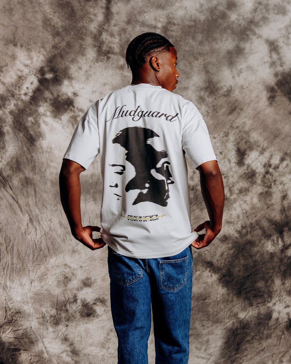 Oversized white graphic t-shirt model back view showing dual print